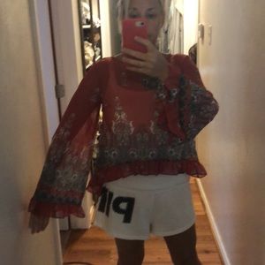 Waist length sheer blouse